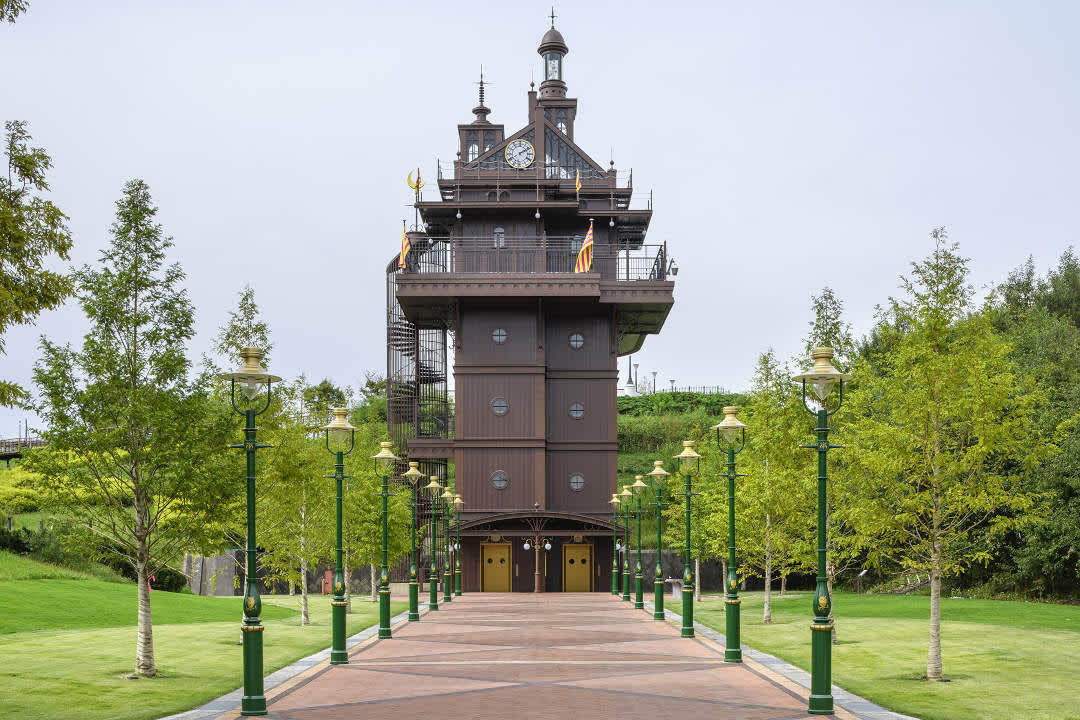 A building with a clock tower at Ghibli Park in Aichi Prefecture